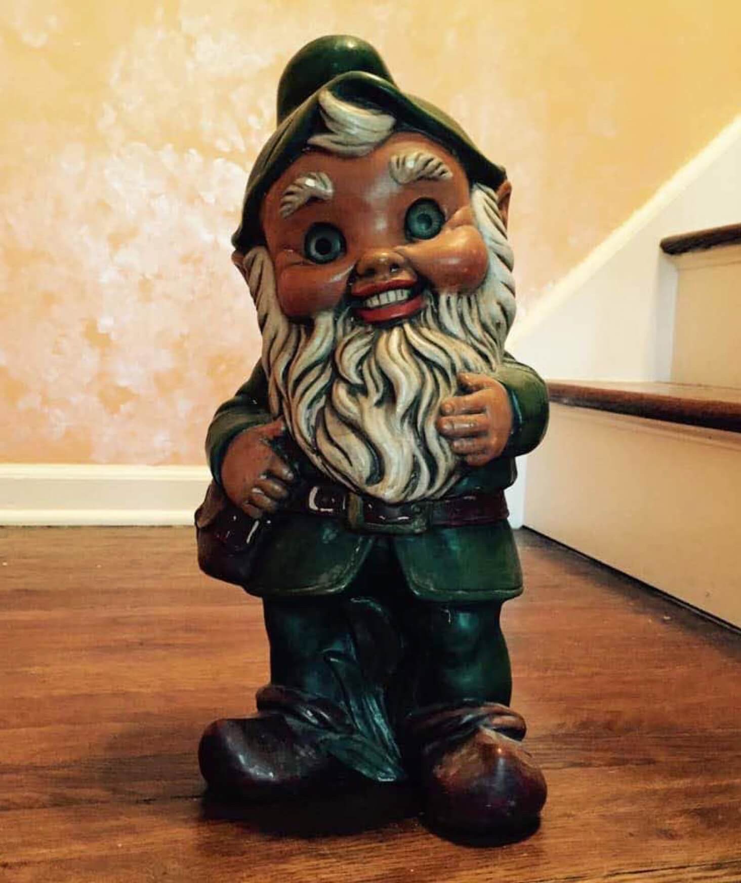 A garden gnome placed on stairs.