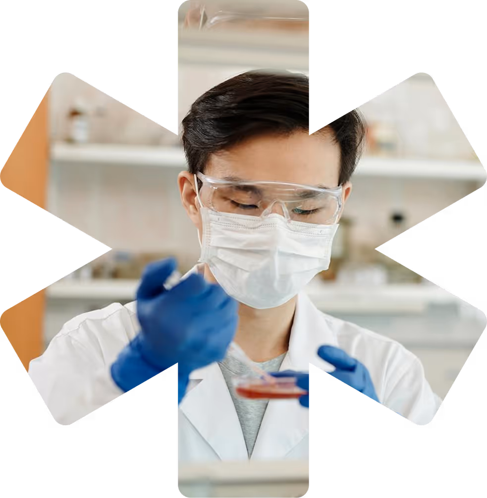 A man in a lab coat and goggles.