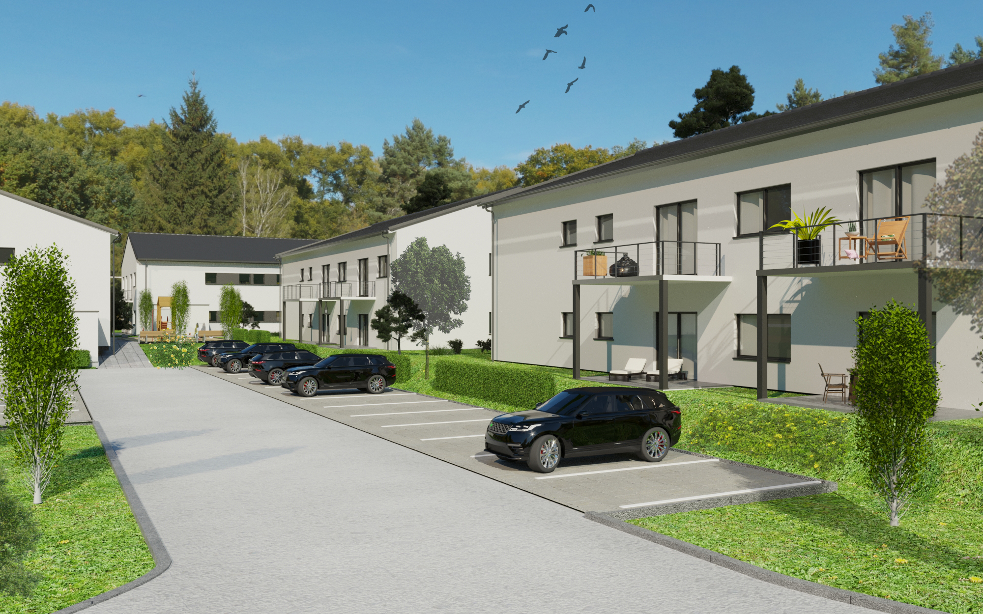 Moderne Wohnanlage mit zwei Gebäuden, Balkonen und Parkplätzen in gepflegter Grünanlage