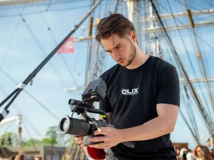 Professional filmmaker working with cinematic equipment for a film production company in Copenhagen