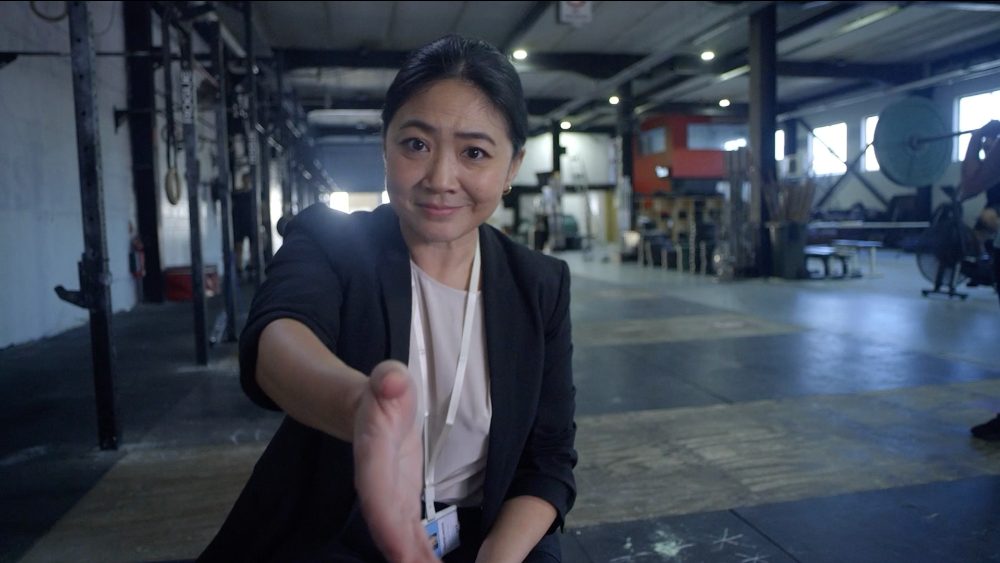 A detective offers a handshake