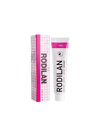 Tube en doos van Rodilan medicinale crème met roze en witte ruiterpatroon.