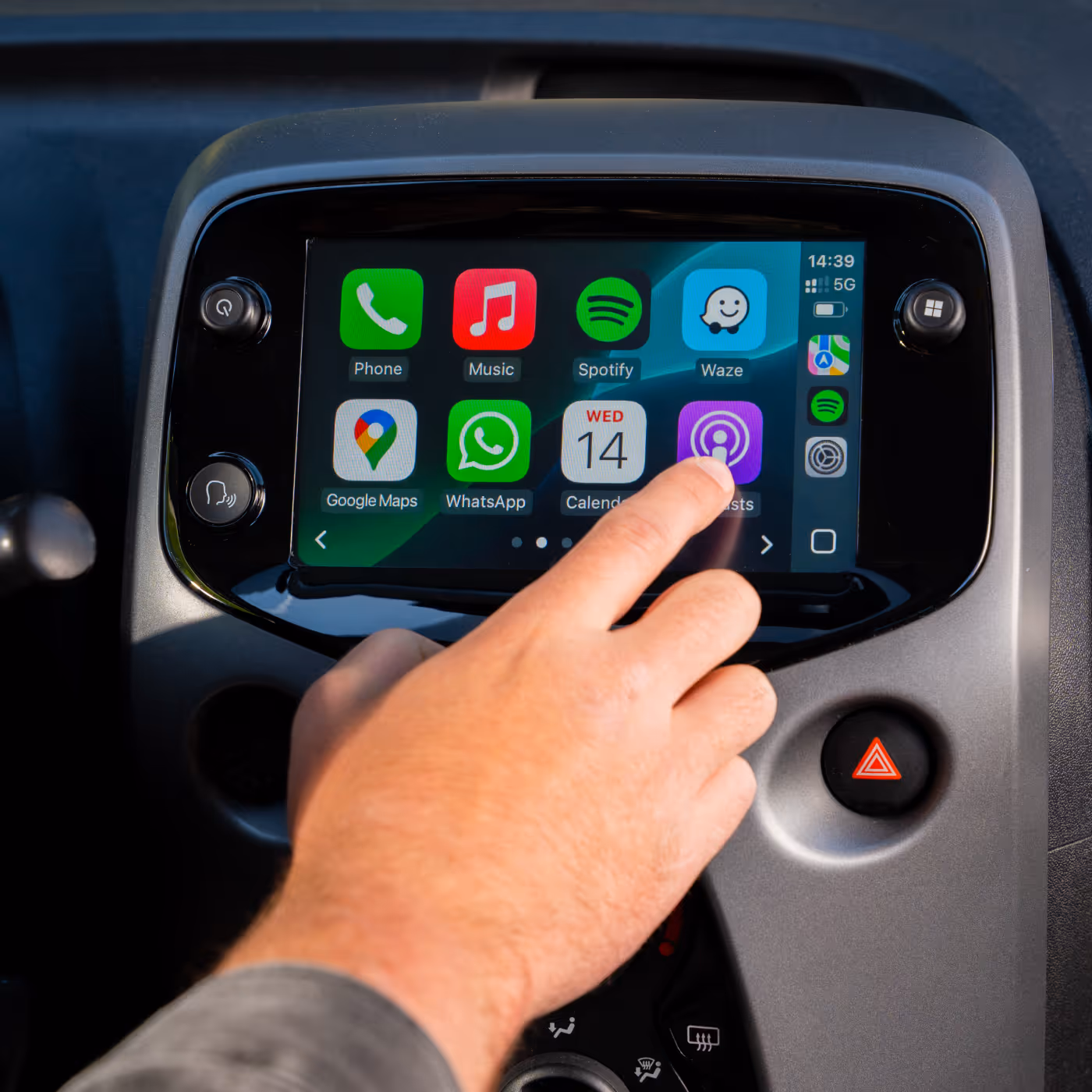 Finger touching head unit screen