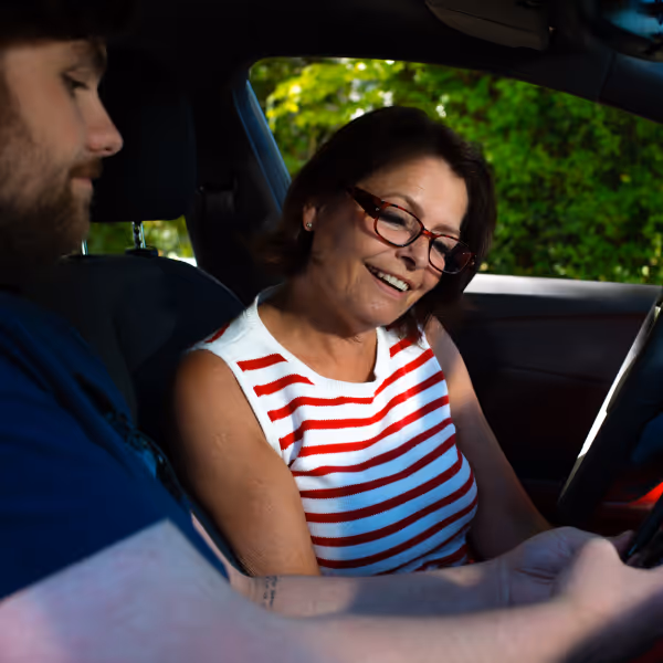 Woman with glasses in car