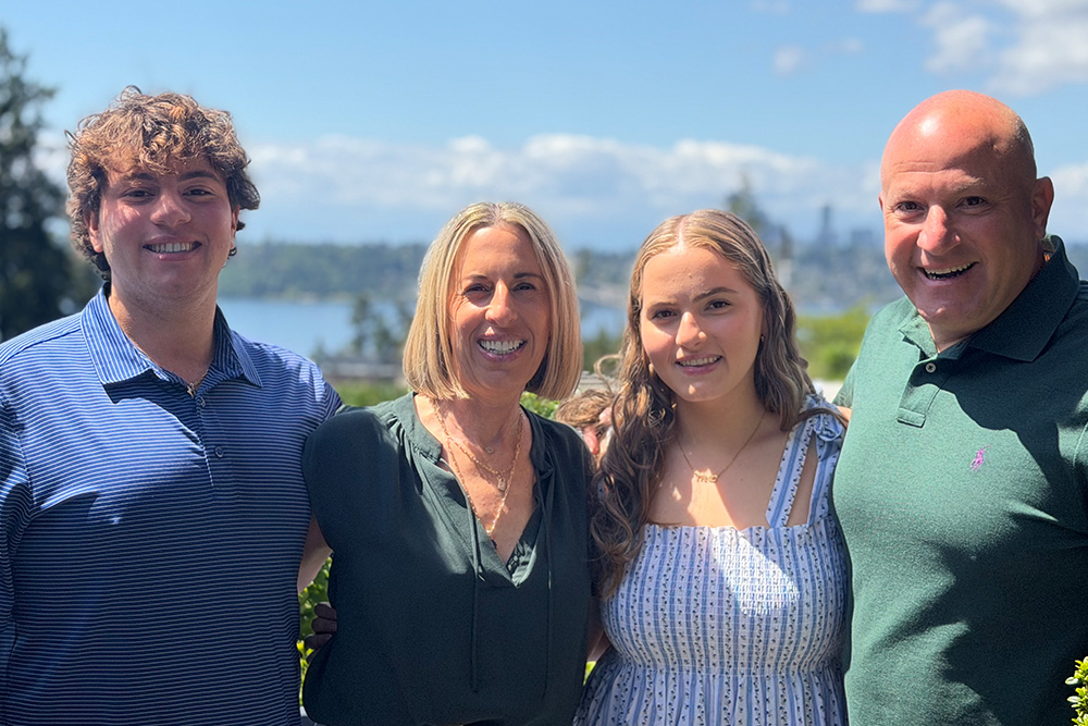 Family photo of Marc Rousso with his wife and two children.