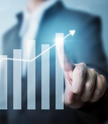 a business background with a graph and hand reaching to point to a highlighted point