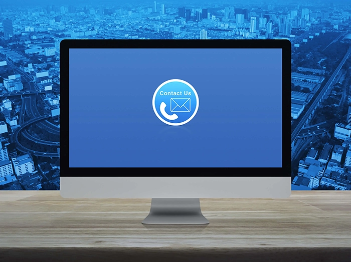 Computer screen with a blue background and a contact us icon displaying