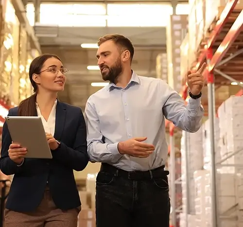 Manager and a Supervisor touring a Warehouse
