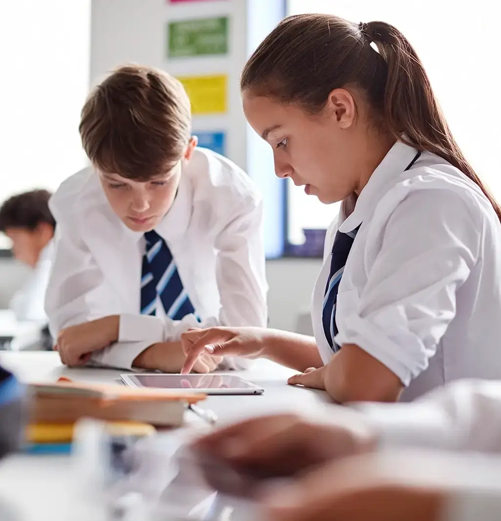 Two secondary school kids studying in a classroom