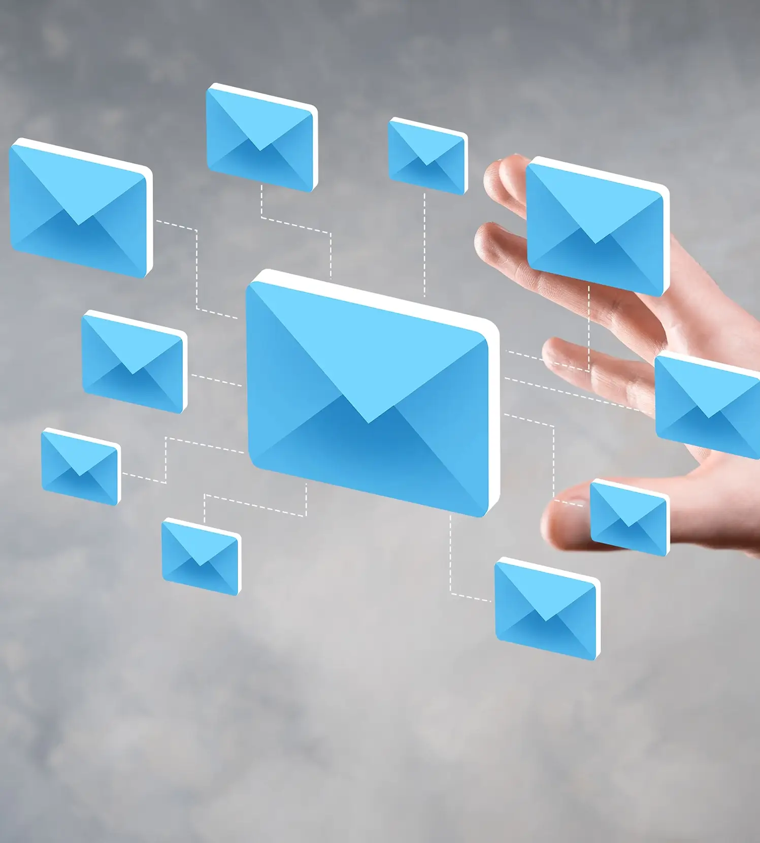 Grey background image with different sized email icons  with a. hand reaching out to them