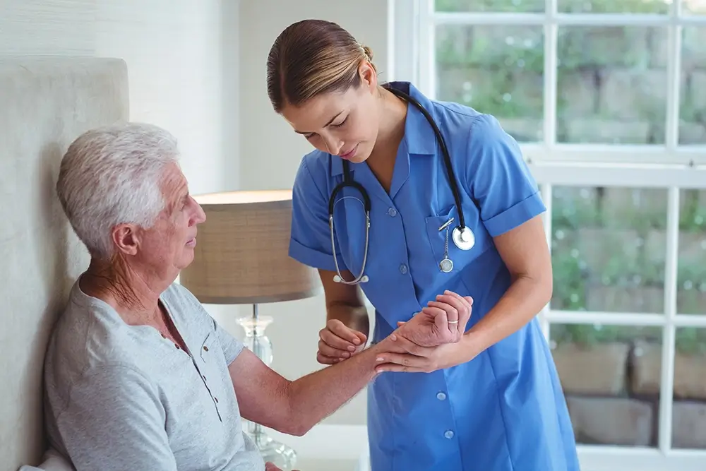 A nurse caring for a elderly women