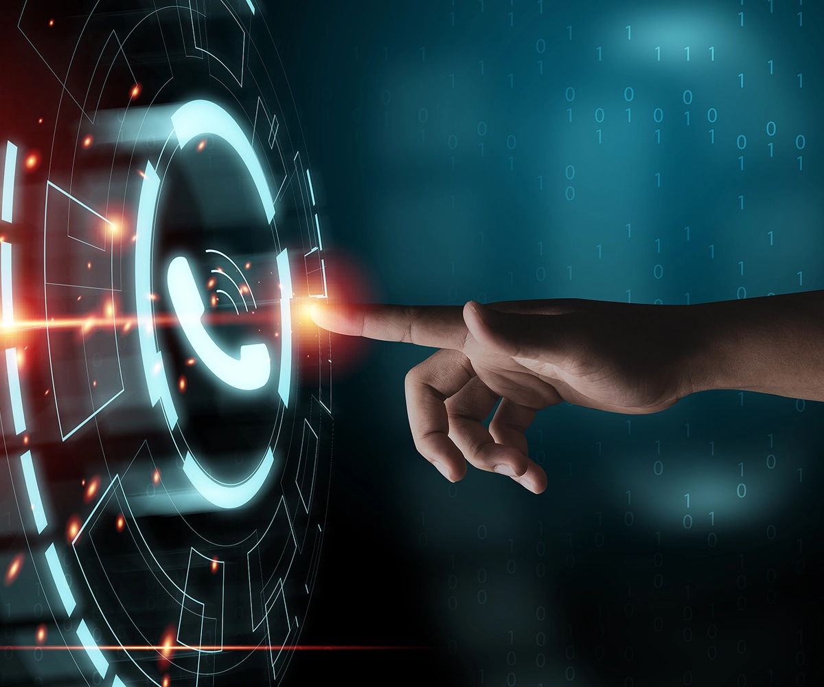 Dark glowing LED phone icon with a finger close to touching it