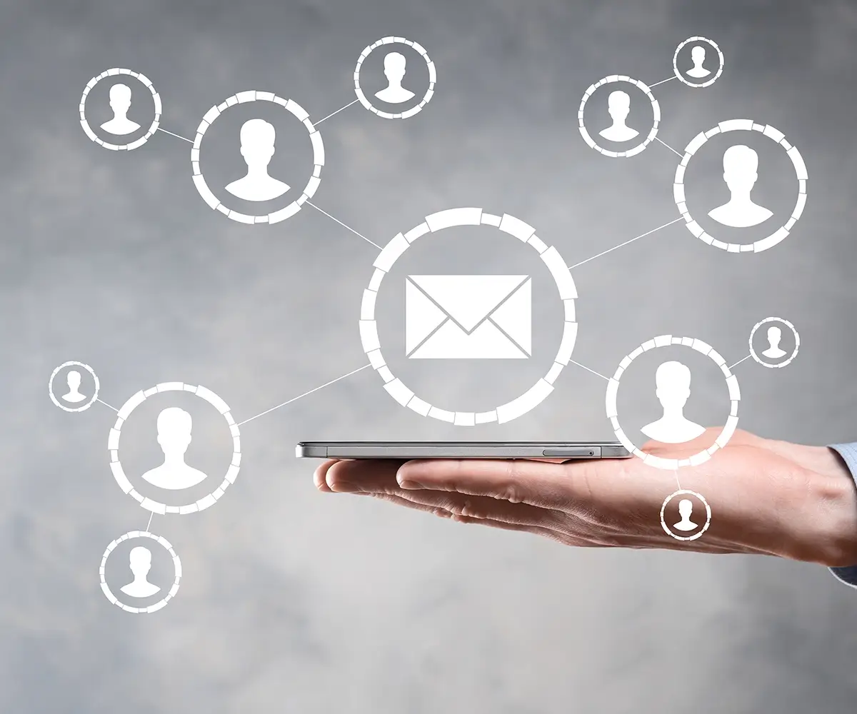 Holding out a persons hand with floating graphical icons in the foreground