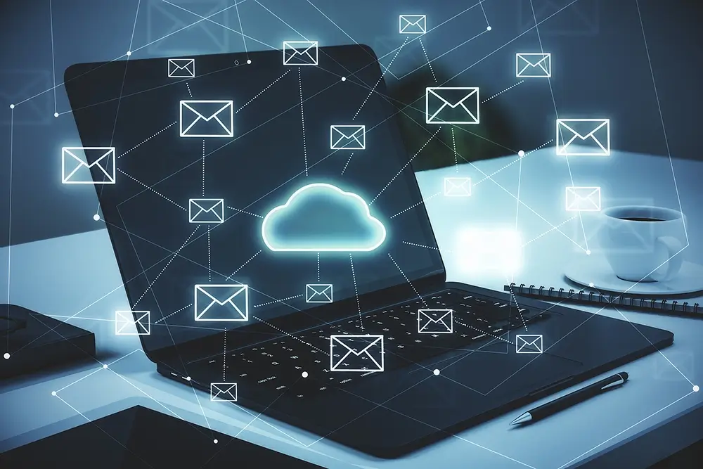 Dark digital background of a laptop with lined communication and data cloud icons