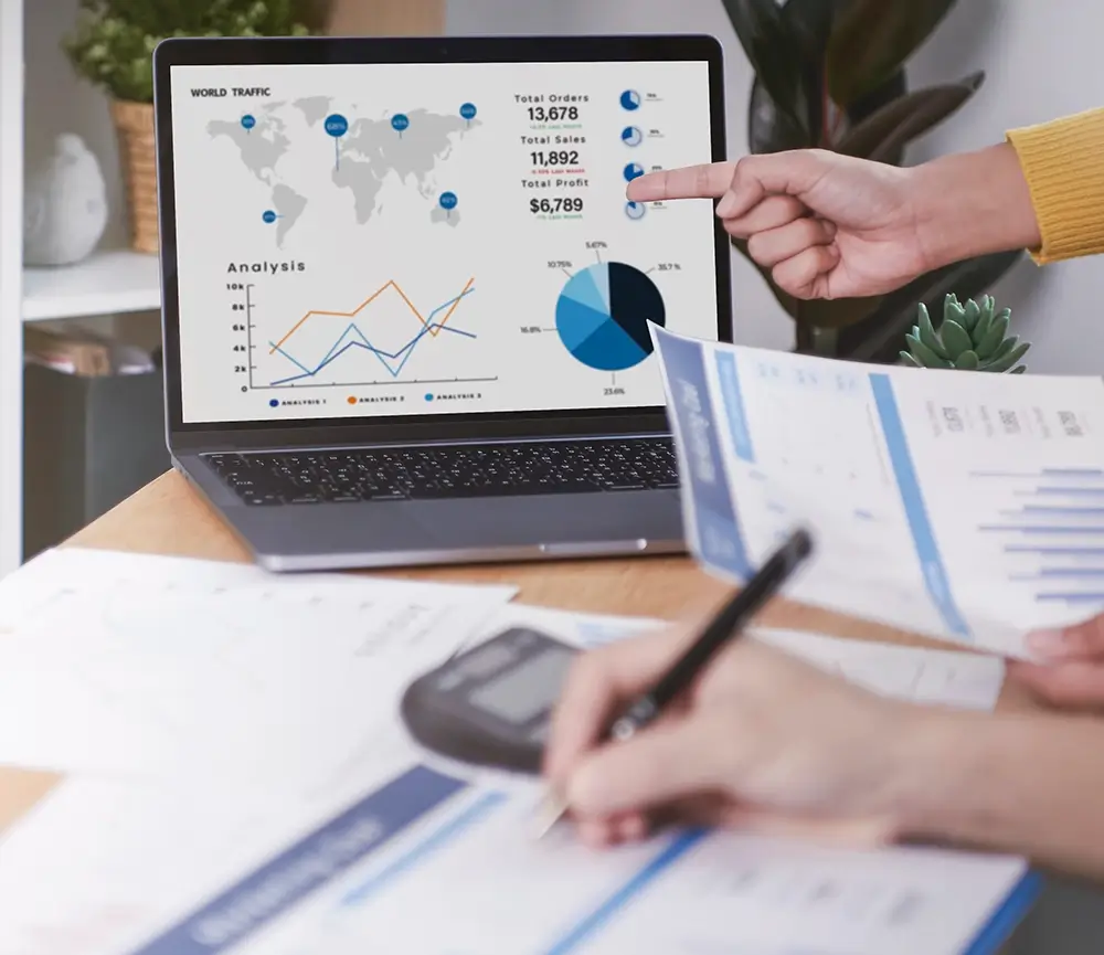 Close-up of people with data dash board and data sheets