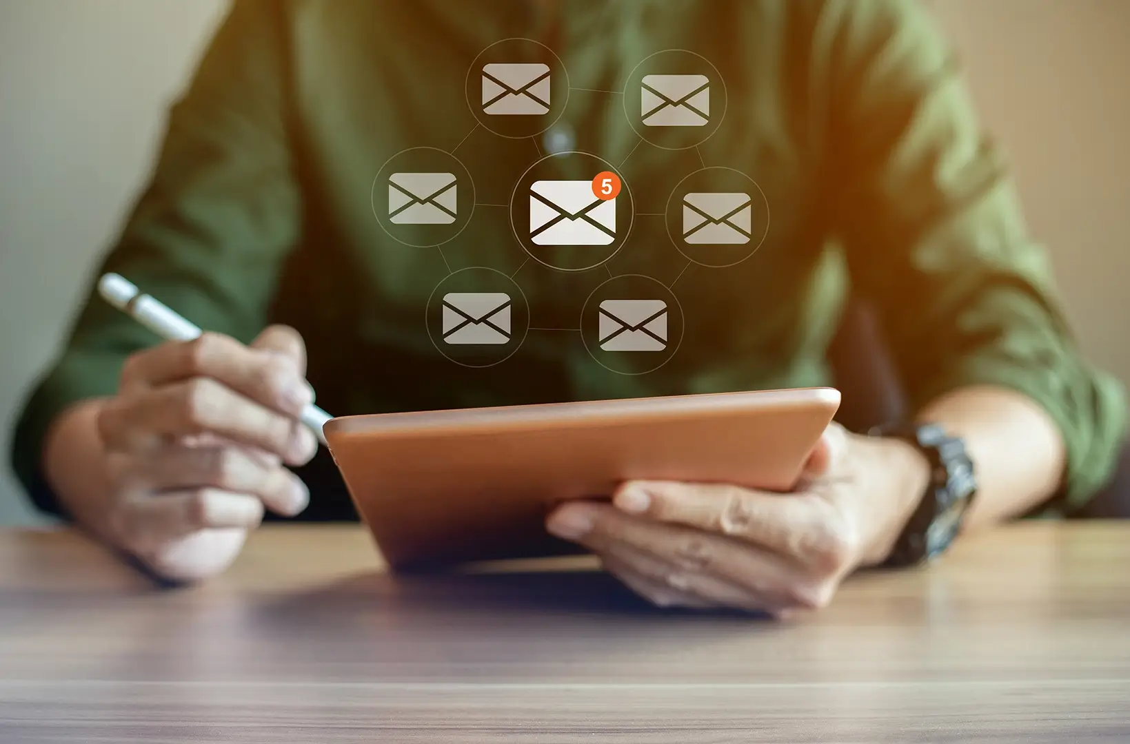 Closeup hand man using tablet with email icons