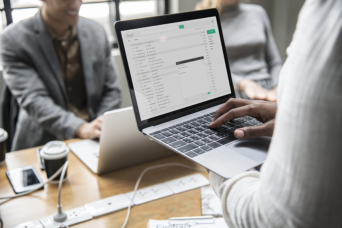 man checking incoming email on his laptop