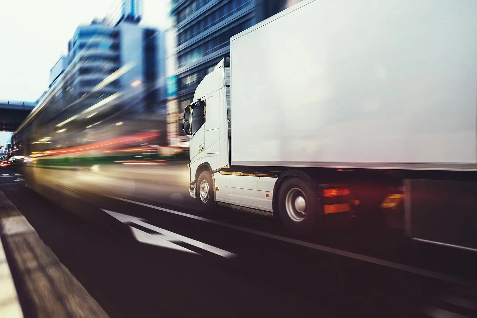 Side view of a moving HGV with a blurred foreground