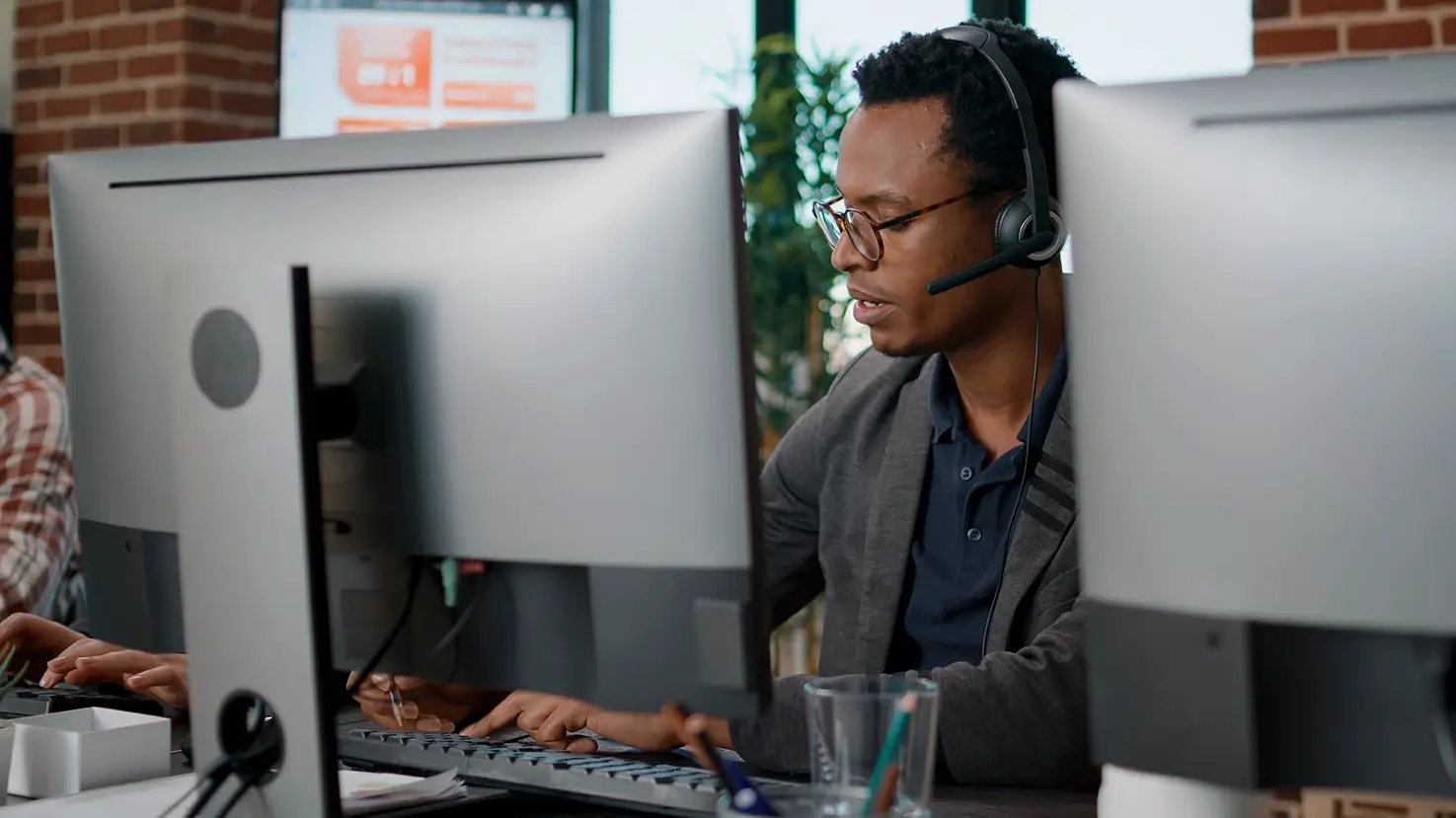 Employee using headset customer service job answering call about telemarketing sales