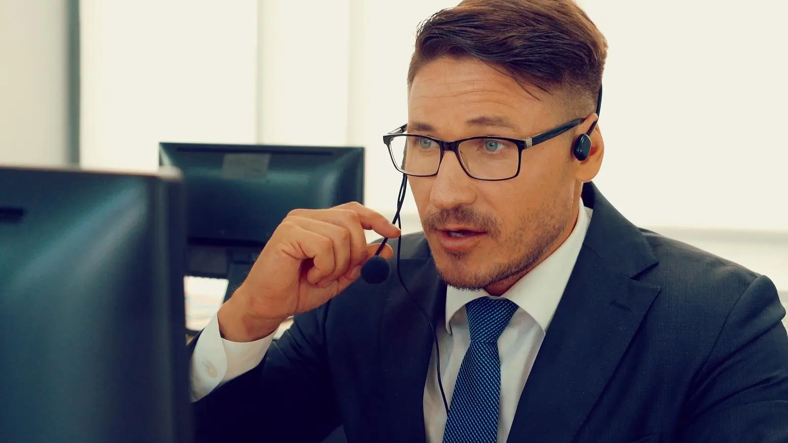Business man wearing glasses and a Headset