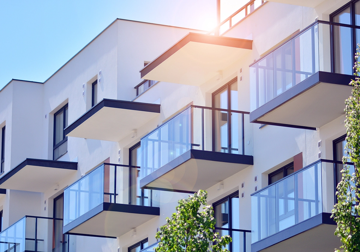 Close up of block of apartments with a blue sky