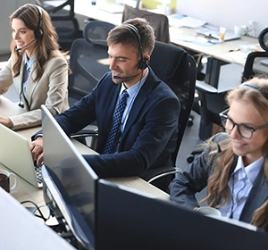 View of people in an office with headsets