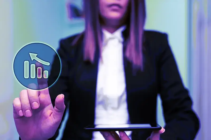 Close up of a business man holding a tablet showing data