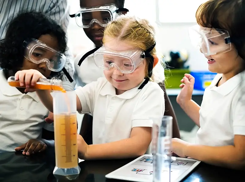 Primary school kids doing a science experiment