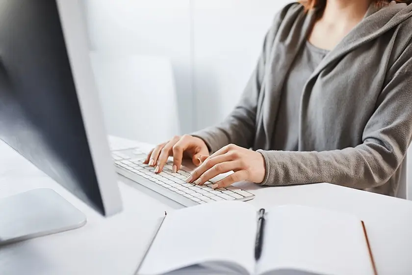 Close-up of a women hands typing on a keyboard