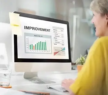Women in front of a computer screen with a finance sheets