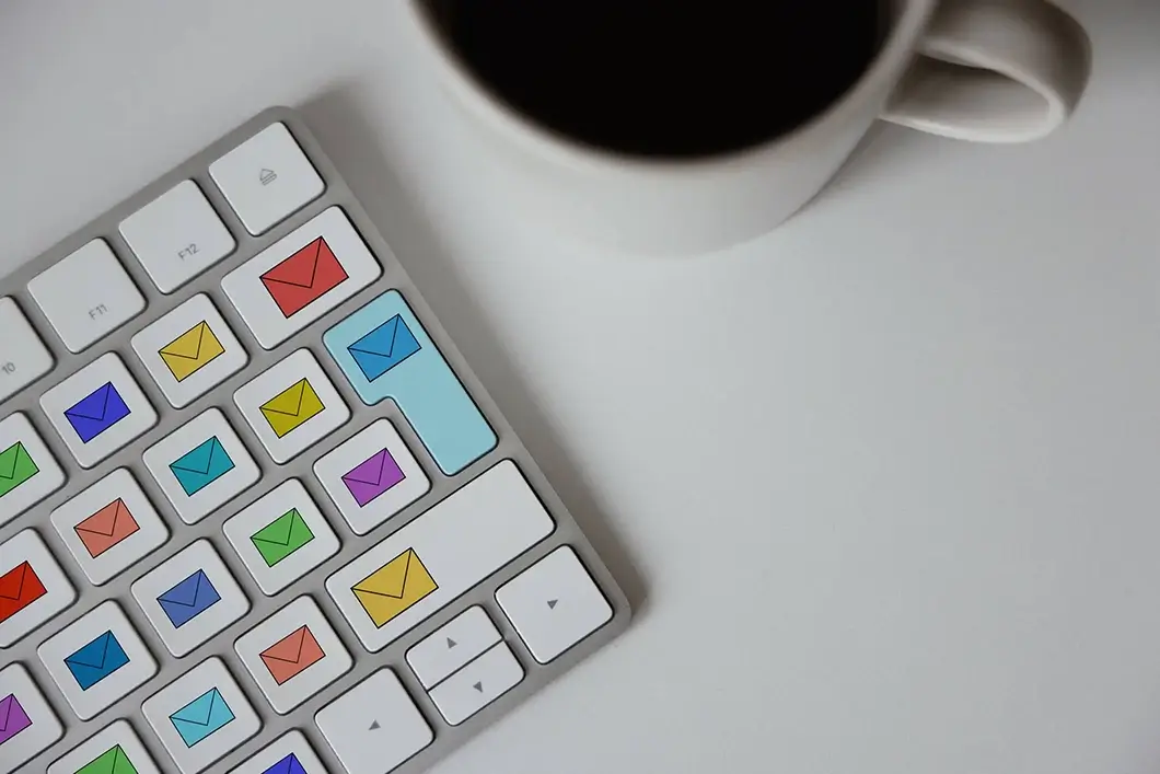 White keyboard with different coloured email icon on the keys