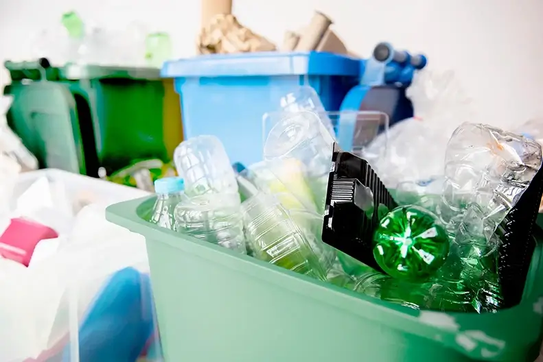 Close-up of recycled plastics in separate bins
