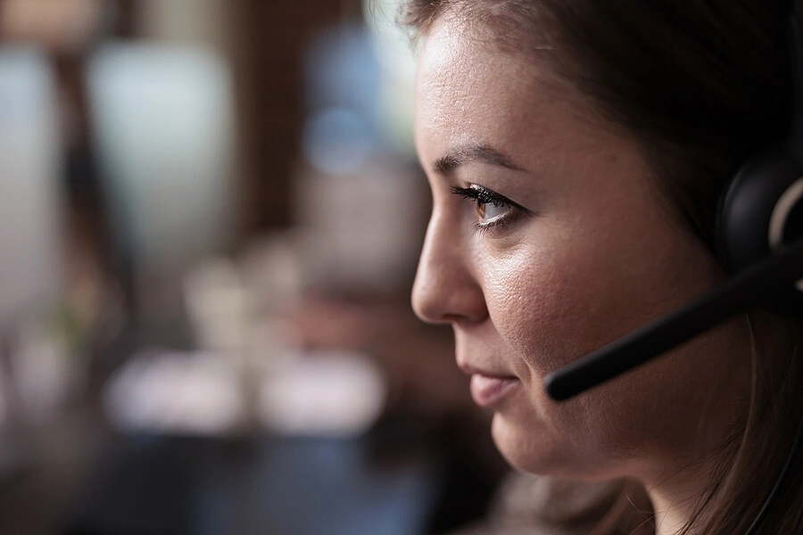 Woman wearing a telephone headset