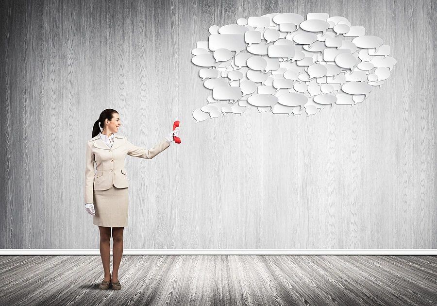 Woman holding telephone to ask lots of questions