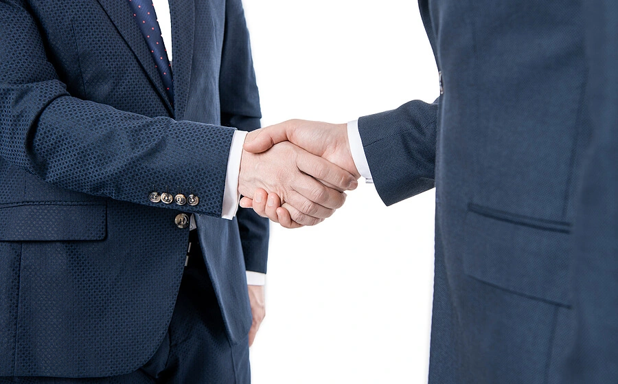 Two business people shaking hands