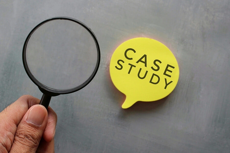 magnifying glass over a speech bubble containing the words case study
