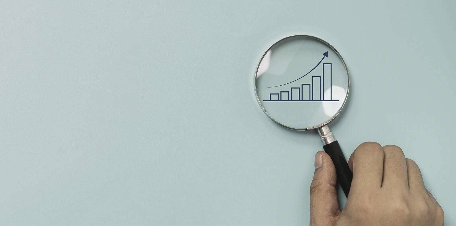 Magnifying glass showing increase in sales