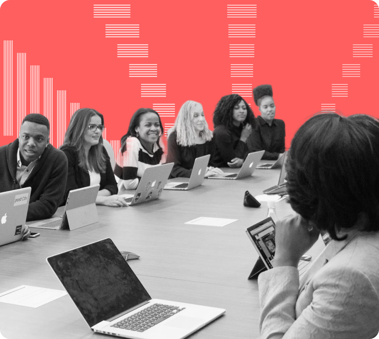 Group of diverse professionals sitting at a conference table with laptops, engaged in a meeting against a coral background with white abstract lines.