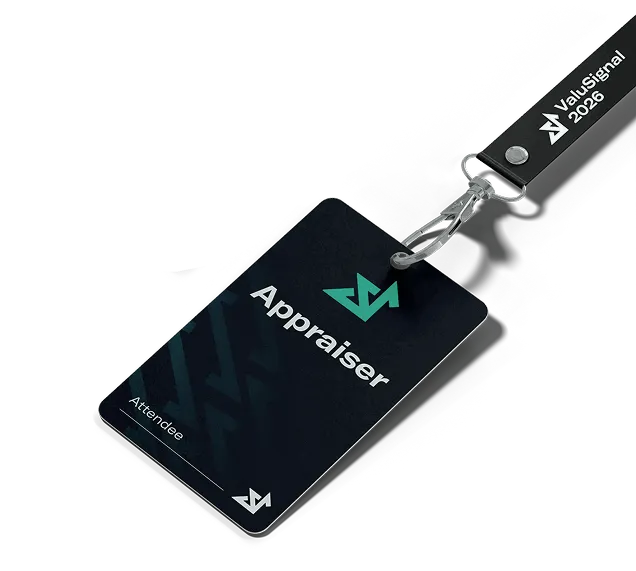 Dark-themed ID badge with 'Appraiser' and 'Attendee' text, featuring a green and white logo, attached to a black lanyard labeled 'ValuSignal 2026'.