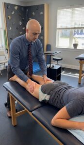 Patient working with a provider at a performance physical therapy clinic in Lebanon, NJ