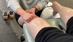 Patient working with a provider at a performance physical therapy clinic in High Bridge