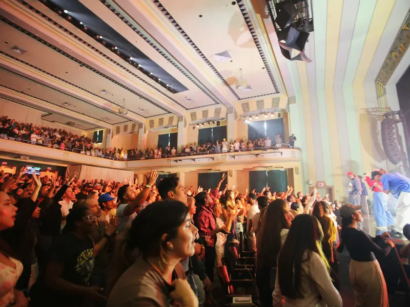 A full room worshipping at VOUS Church