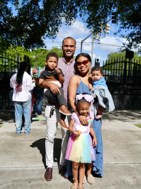A family with young children outside VOUS
