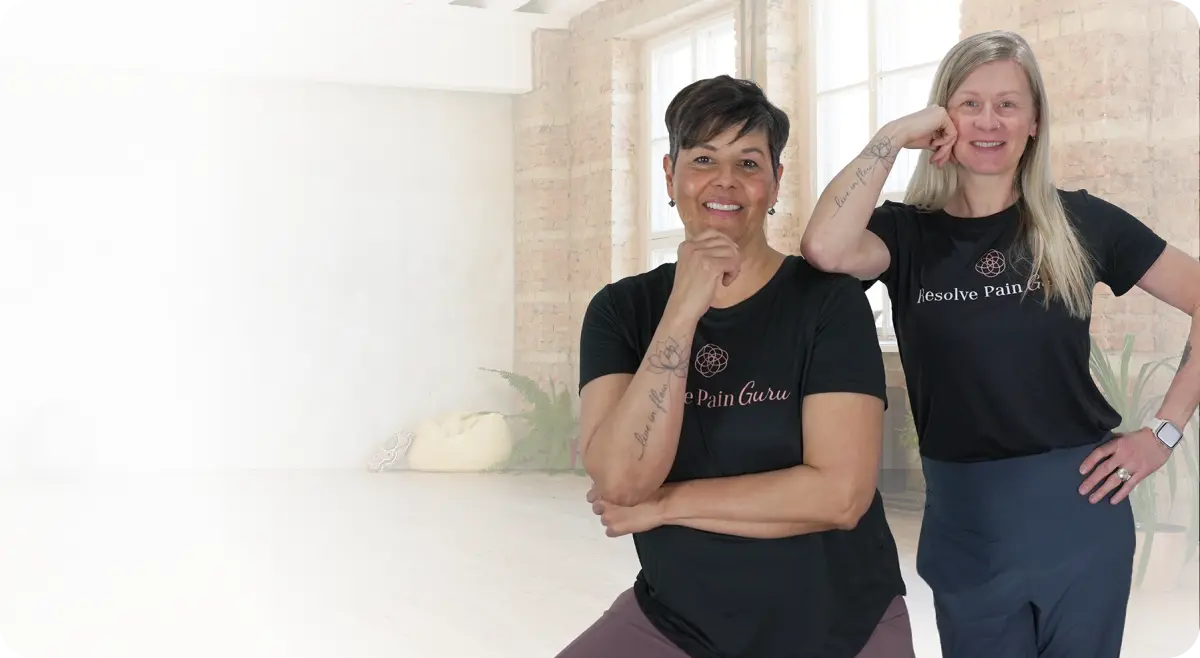 Carrie and Nicole smiling in their Resolve Pain Guru shirts