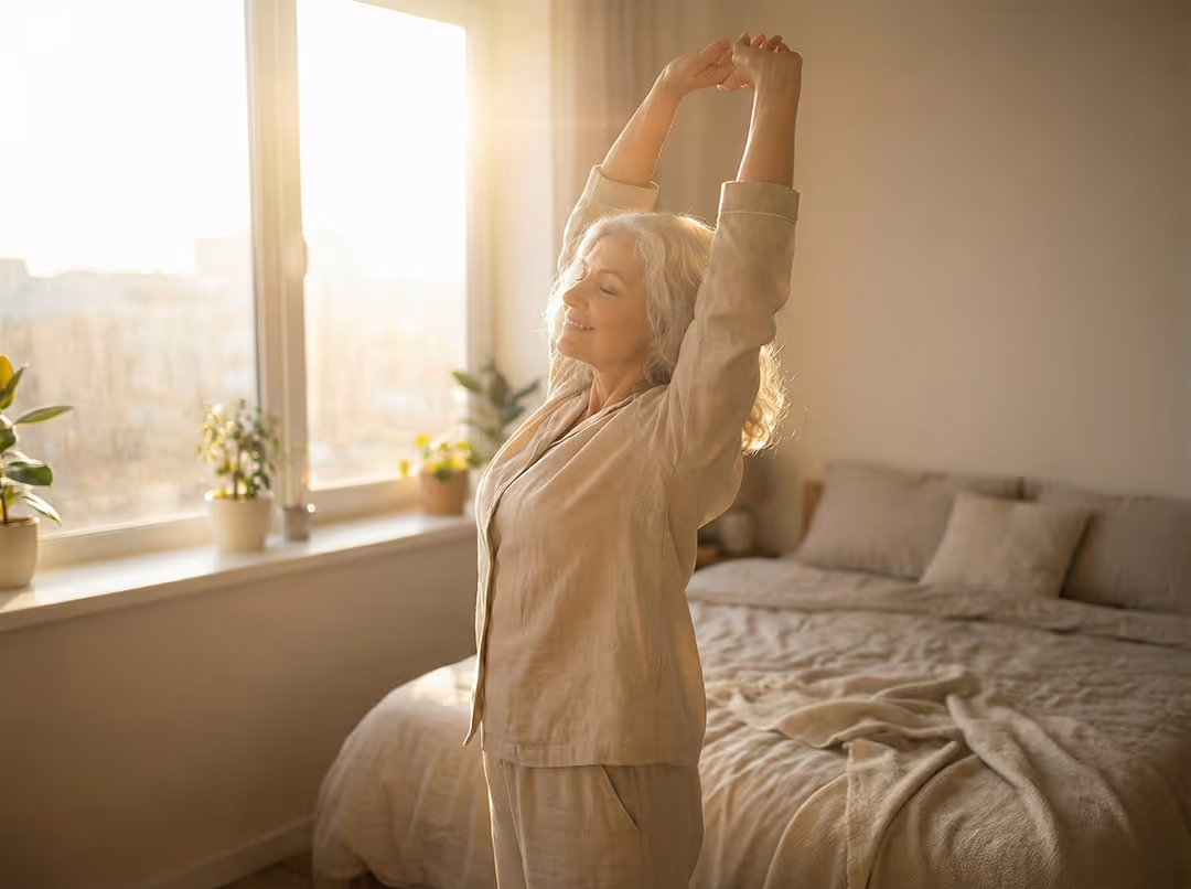 Older woman stretching gently, illustrating why static stretching alone does not relieve chronic tightness