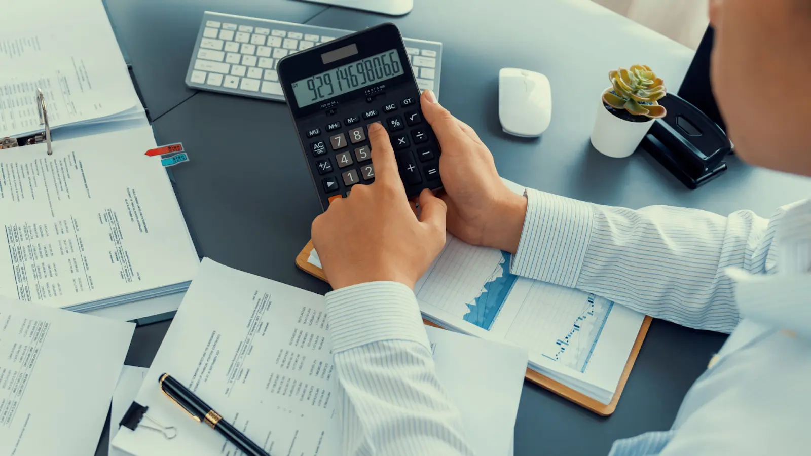 Finance analyst reconciling invoice deductions and chargebacks with supporting documents.