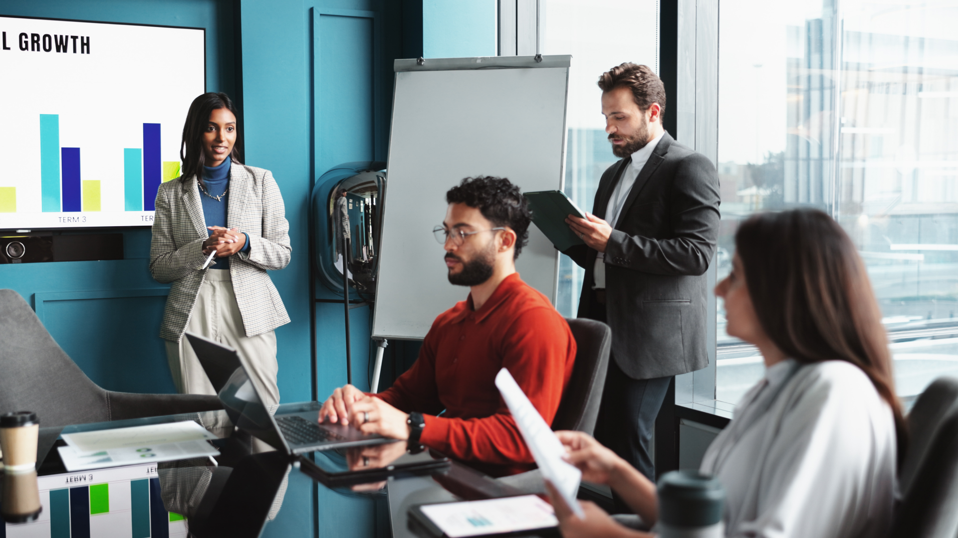 Team meeting around charts during the trade promotion optimization process