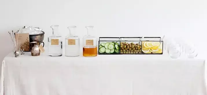 A bar set up with ingredients for martinis