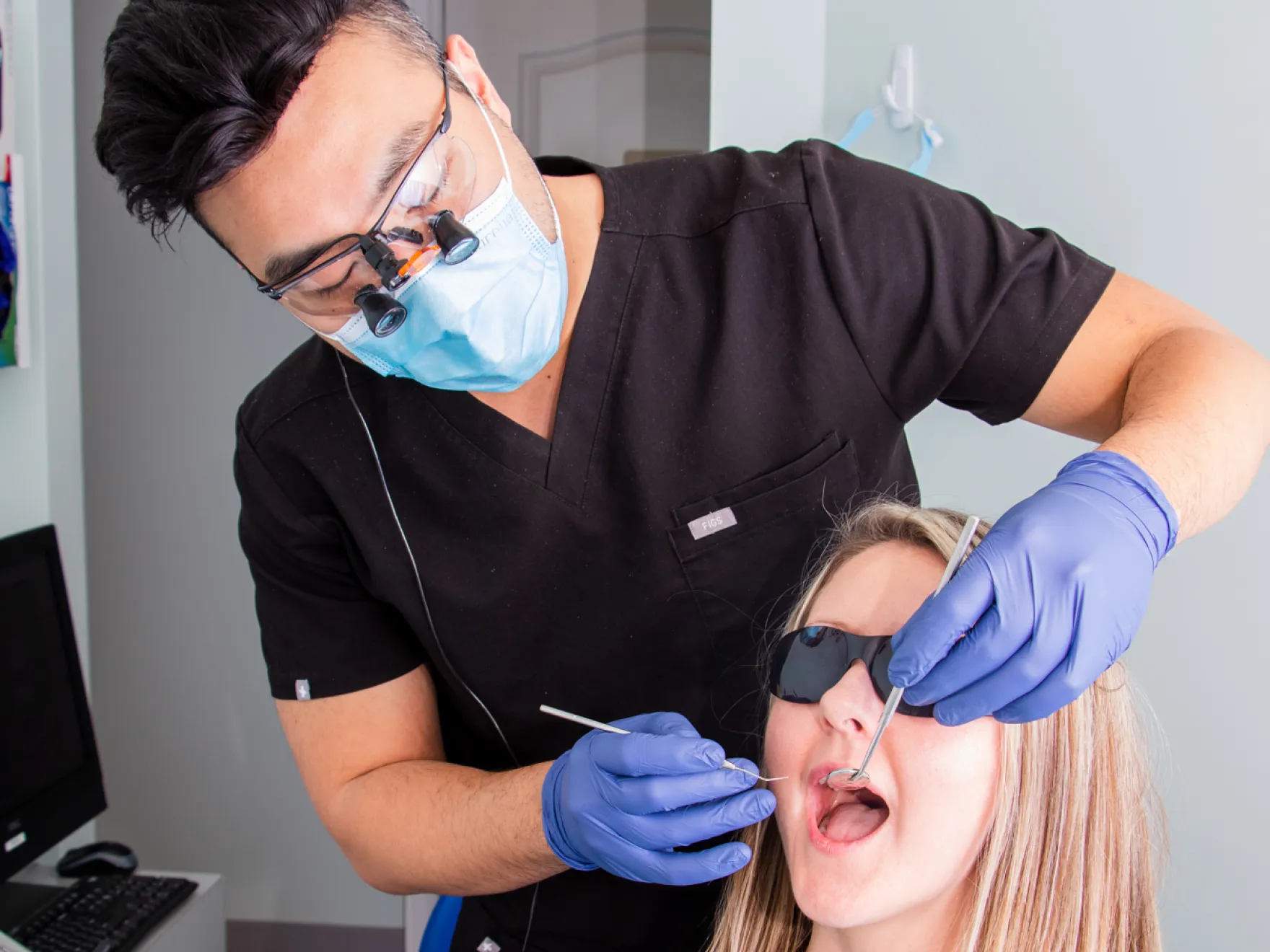 Dentist checking patient