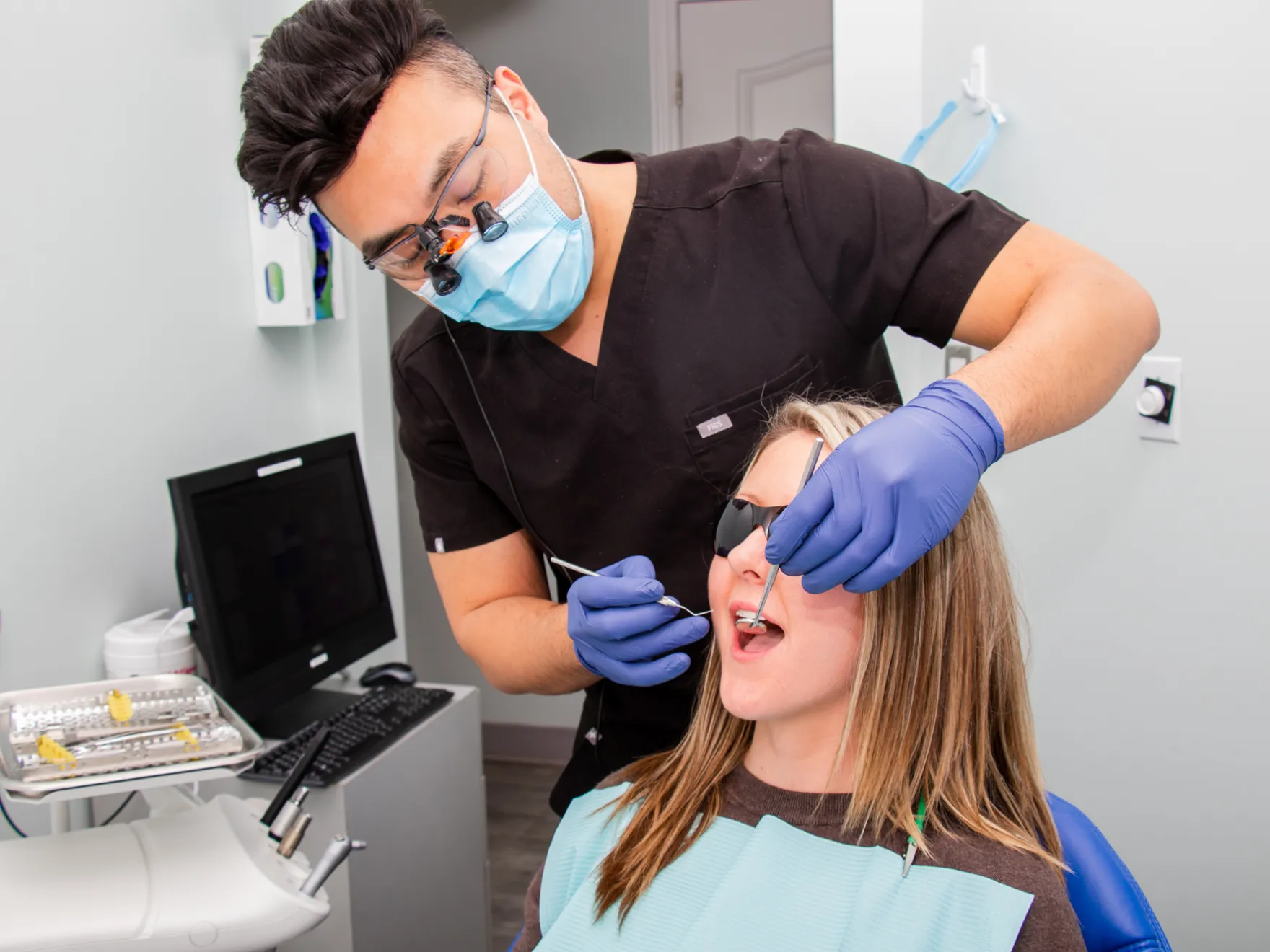 Dr. Siu checking patient